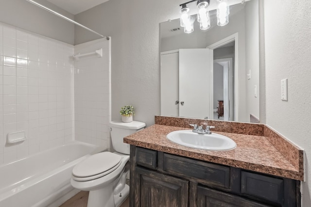 full bathroom with vanity, shower / bathing tub combination, and toilet