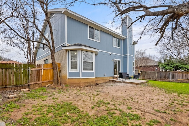 rear view of house with a patio