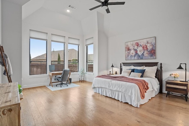113 University Lands Dr, Liberty Hill, TX 78642 - bedroom with light wood finished floors, high vaulted ceiling, baseboards, a desk, and ceiling fan
