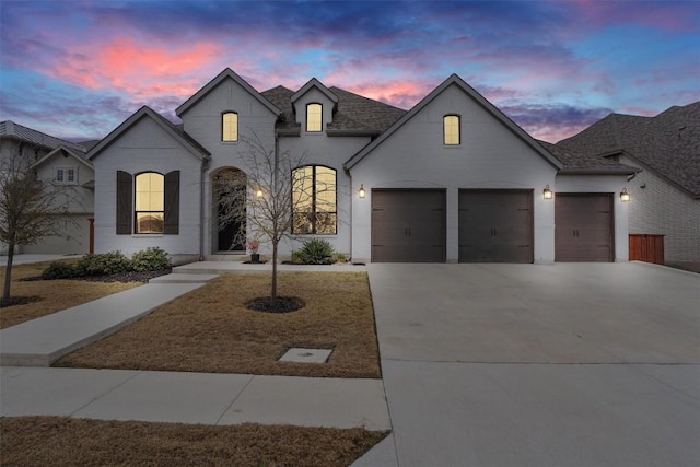 french country inspired facade with a garage