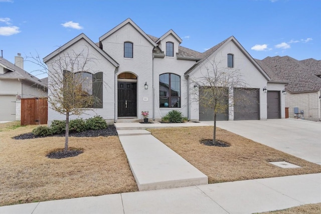 french country inspired facade with a garage