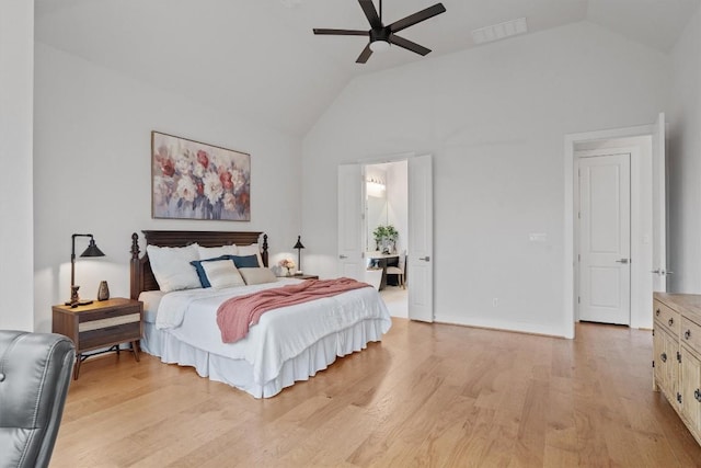 113 University Lands Dr, Liberty Hill, TX 78642 - bedroom with lofted ceiling, light wood-style floors, and a ceiling fan