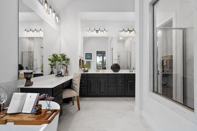 113 University Lands Dr, Liberty Hill, TX 78642 - full bathroom with marble look tiles, vanity, and a shower with shower door