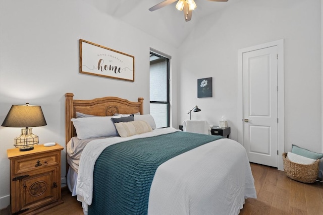 113 University Lands Dr, Liberty Hill, TX 78642 - bedroom featuring lofted ceiling, wood finished floors, and a ceiling fan
