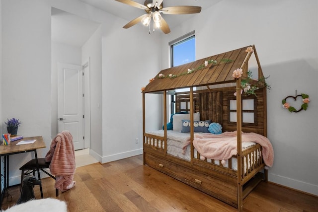 113 University Lands Dr, Liberty Hill, TX 78642 - bedroom featuring light wood-style floors and baseboards