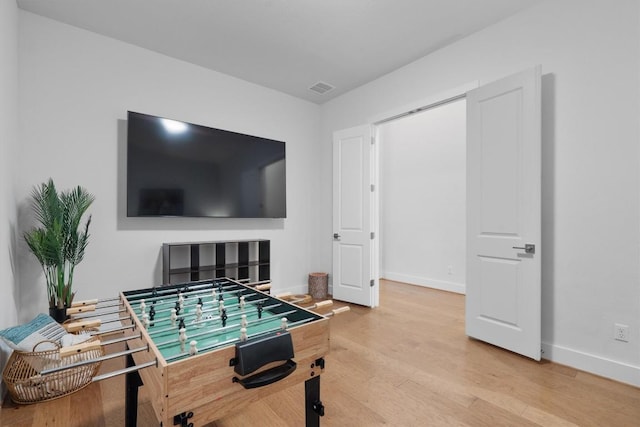 113 University Lands Dr, Liberty Hill, TX 78642 - playroom with baseboards and light wood-style flooring
