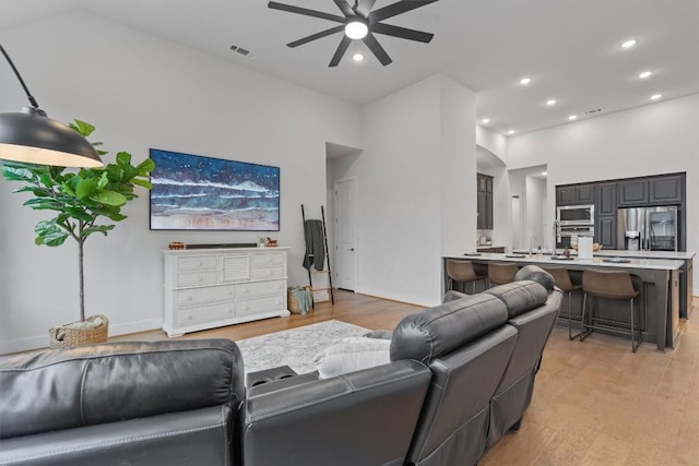 113 University Lands Dr, Liberty Hill, TX 78642 - living room with ceiling fan, light wood finished floors, and recessed lighting