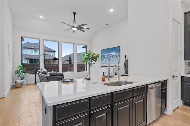 113 University Lands Dr, Liberty Hill, TX 78642 - kitchen with stainless steel dishwasher, a sink, a ceiling fan, light countertops, and vaulted ceiling