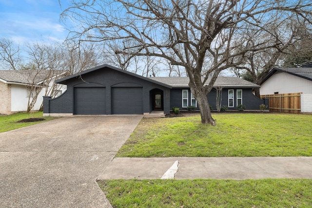 single story home with a garage and a front lawn