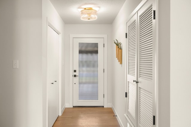 doorway to outside featuring light hardwood / wood-style flooring