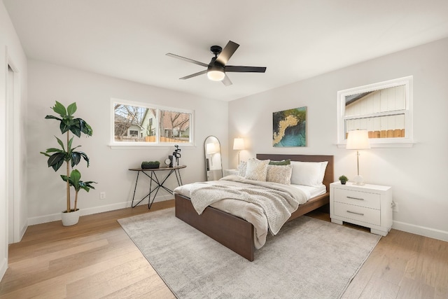 bedroom featuring light hardwood / wood-style floors and ceiling fan