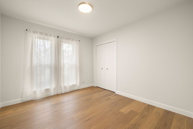 spare room featuring light wood-type flooring