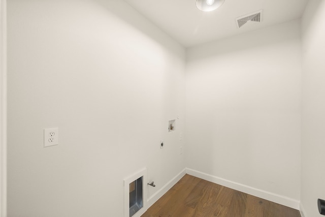 washroom featuring hookup for a washing machine, gas dryer hookup, hookup for an electric dryer, and dark hardwood / wood-style flooring