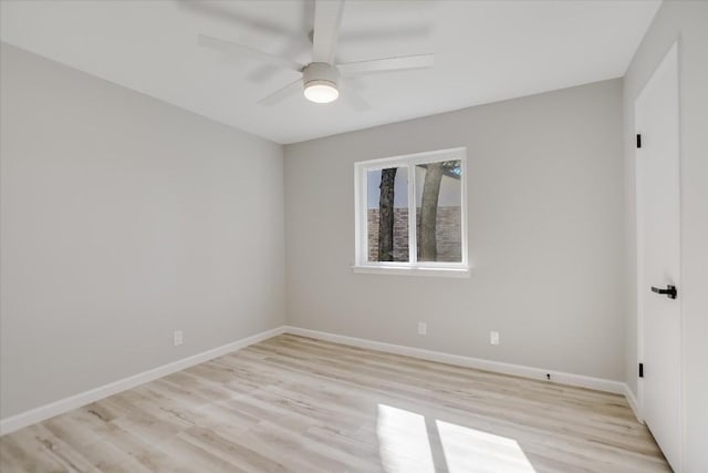 empty room featuring ceiling fan and light wood-type flooring