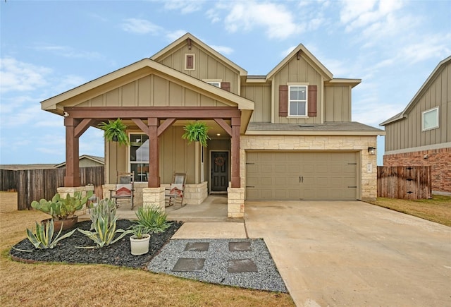 craftsman inspired home with a porch and a garage