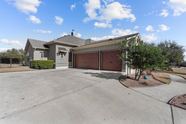 ranch-style house featuring a garage