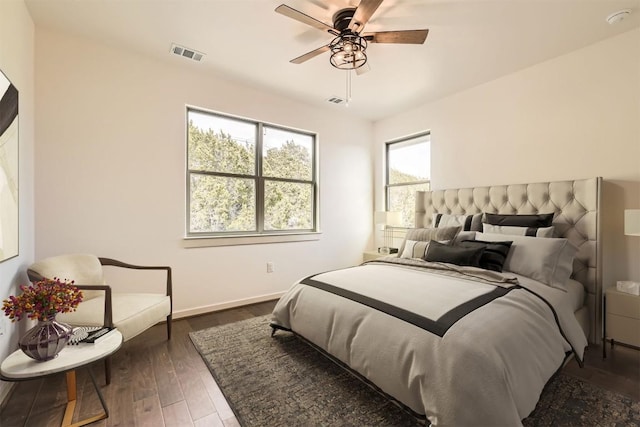 22300 Shotts Dr, Spicewood, TX 78669 - bedroom featuring dark wood-style flooring, baseboards, and a ceiling fan
