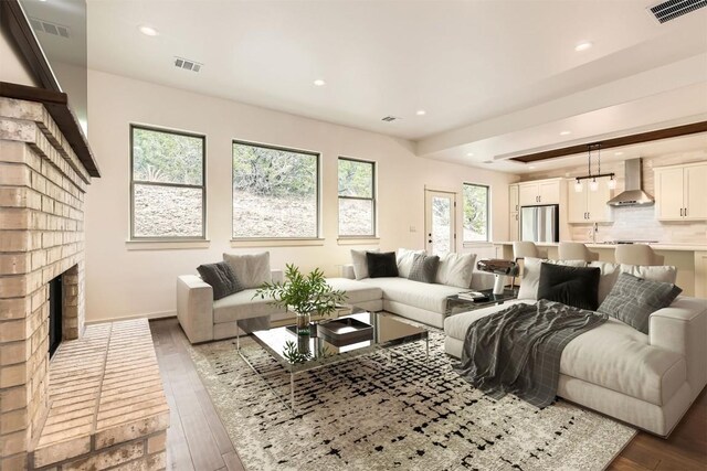 22300 Shotts Dr, Spicewood, TX 78669 - living area with hardwood / wood-style floors, recessed lighting, and a fireplace