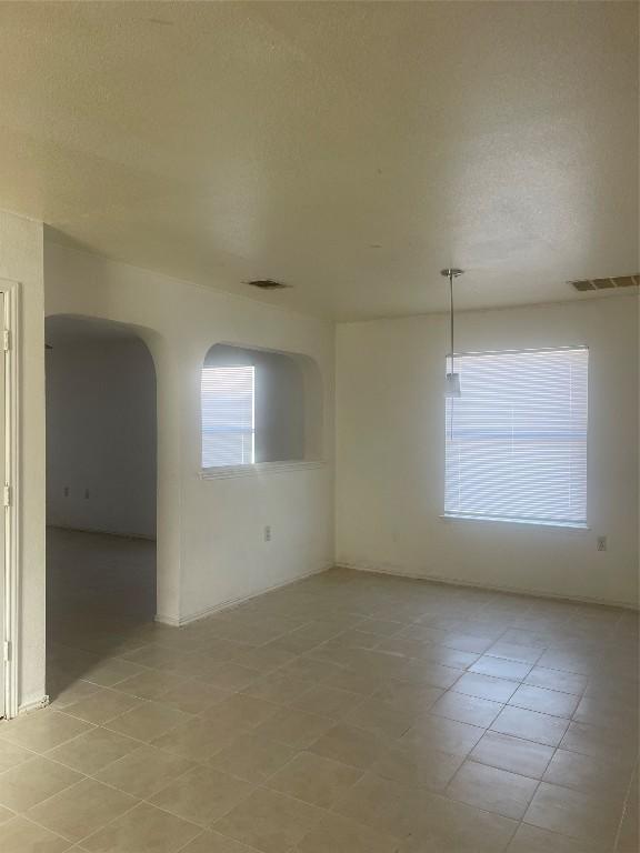 spare room featuring a textured ceiling