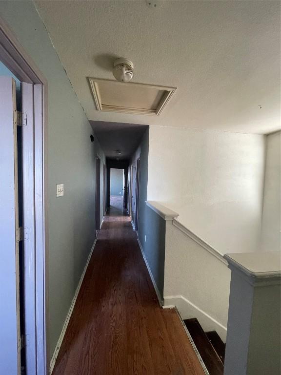 hallway featuring dark wood-type flooring