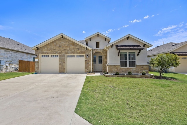 view of front of property with a garage and a front lawn