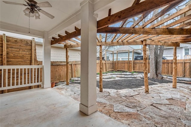 view of patio / terrace featuring ceiling fan and a pergola