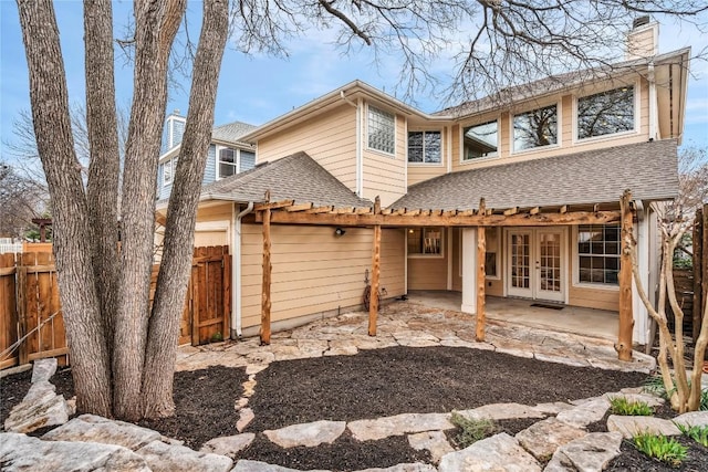 rear view of house featuring a patio and french doors