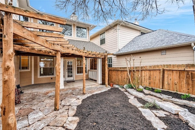 rear view of house featuring a patio area and a pergola