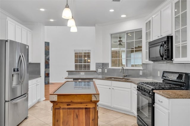 kitchen with sink, white cabinetry, a center island, hanging light fixtures, and black appliances