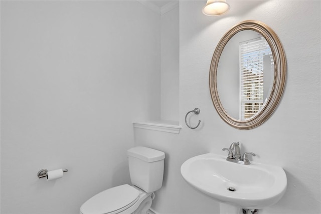 bathroom with sink and toilet