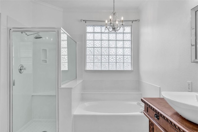 bathroom with vanity, ornamental molding, independent shower and bath, and a chandelier