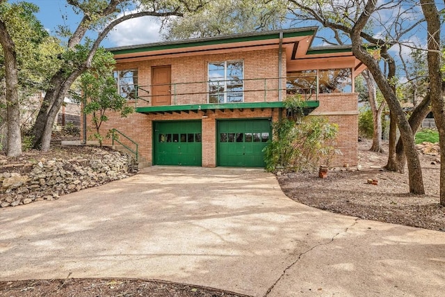 view of front facade with a garage and a balcony