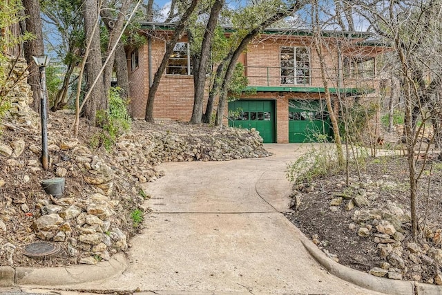 view of front of property with a garage and a balcony