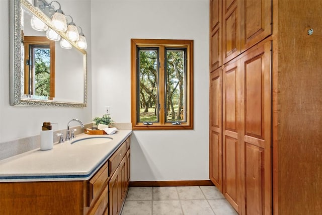 bathroom with vanity, plenty of natural light, and tile patterned floors