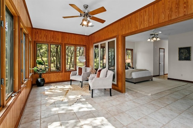 sunroom / solarium with ceiling fan