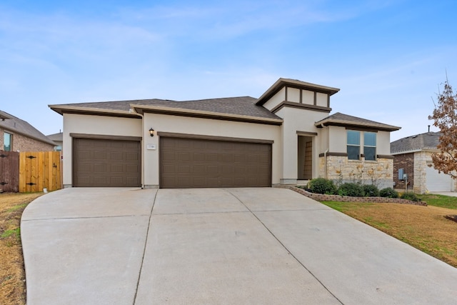 prairie-style house featuring a garage