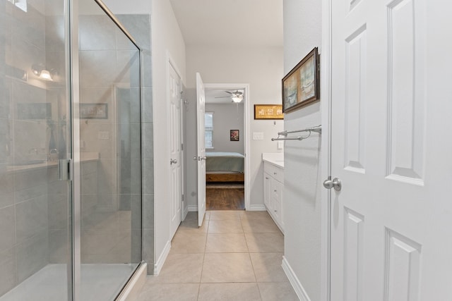 7716 Arezzo Dr, Round Rock, TX 78665 - ensuite bathroom featuring a stall shower, ceiling fan, tile patterned floors, and vanity