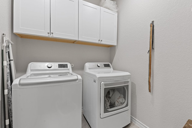 7716 Arezzo Dr, Round Rock, TX 78665 - laundry room featuring washer and clothes dryer and cabinet space