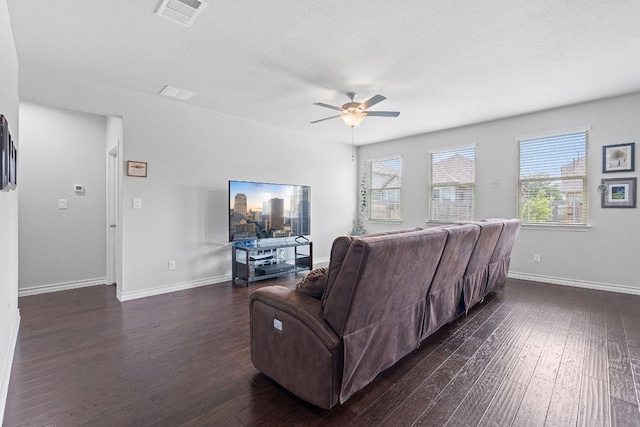 7716 Arezzo Dr, Round Rock, TX 78665 - living area featuring a ceiling fan and dark wood-style flooring