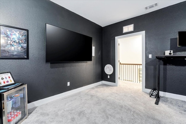 312 Olinda Way, Liberty Hill, TX 78642 - rec room featuring baseboards, a textured wall, visible vents, and carpet