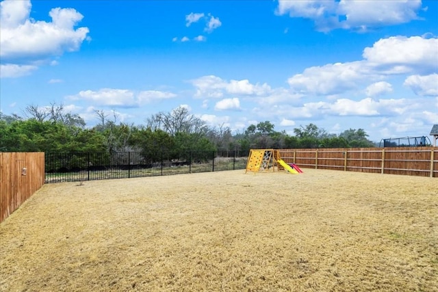 312 Olinda Way, Liberty Hill, TX 78642 - view of yard with fence and a playground