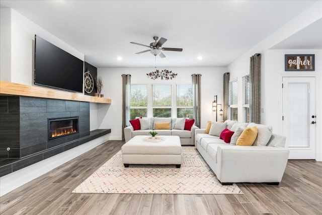 312 Olinda Way, Liberty Hill, TX 78642 - living area with wood finished floors, recessed lighting, a fireplace, and ceiling fan