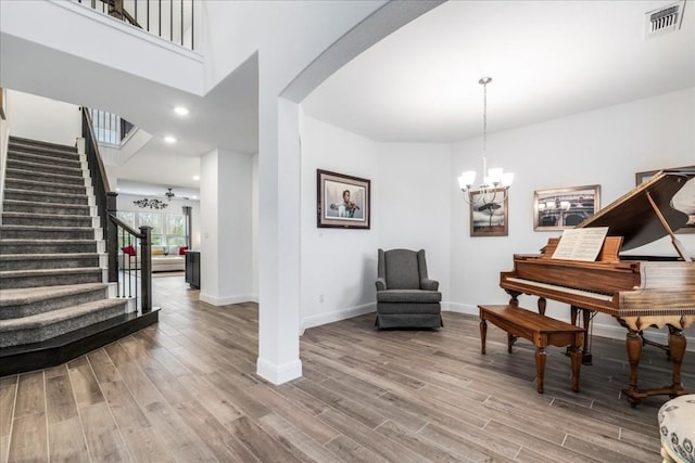 sitting room featuring hardwood / wood-style flooring and a notable chandelier