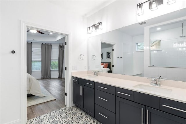 312 Olinda Way, Liberty Hill, TX 78642 - full bath with a sink, double vanity, ensuite bathroom, and a ceiling fan