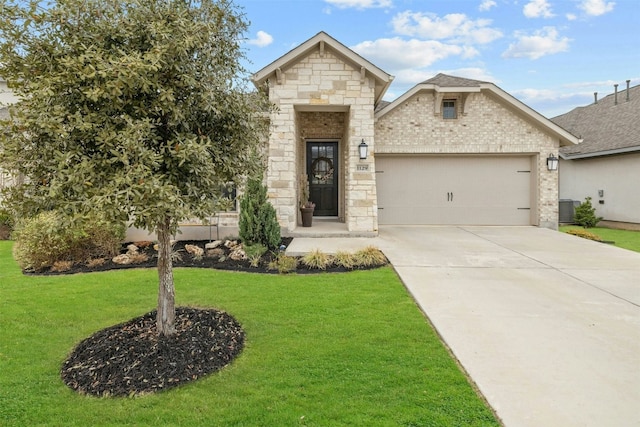 view of front of property with a garage, concrete driveway, stone siding, a front lawn, and central AC