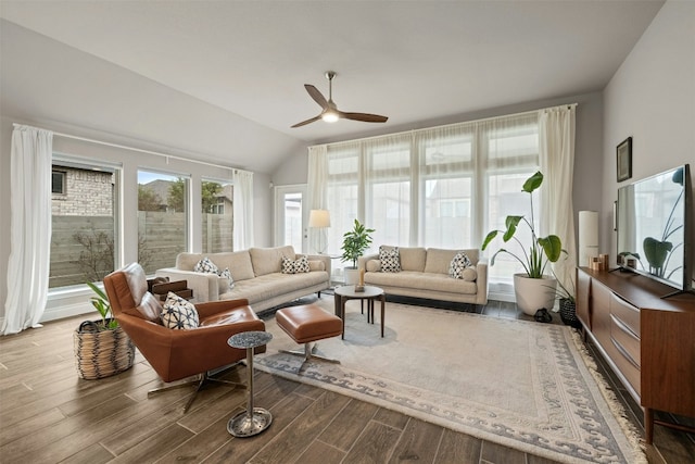 sunroom with a ceiling fan and vaulted ceiling