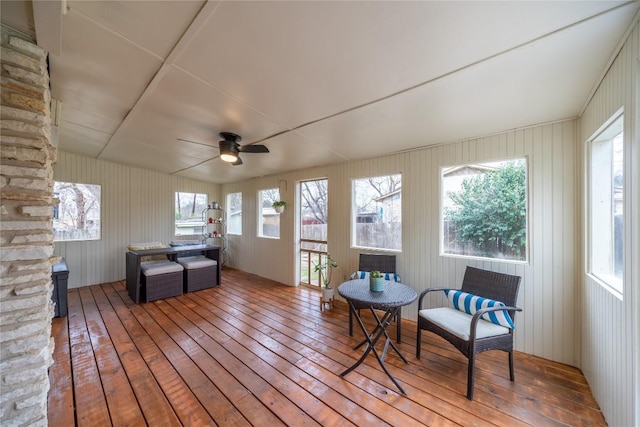 sunroom featuring ceiling fan