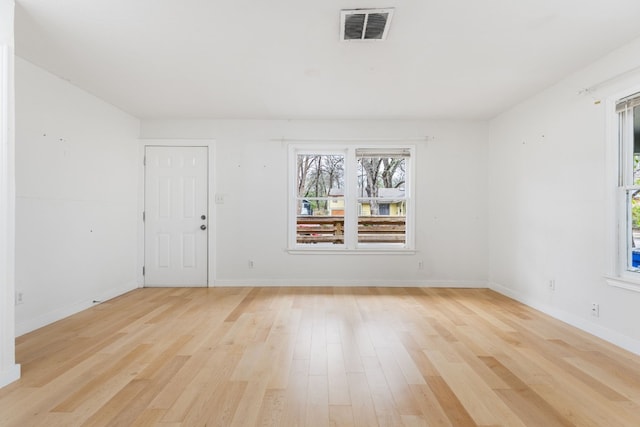 unfurnished room featuring light wood-type flooring