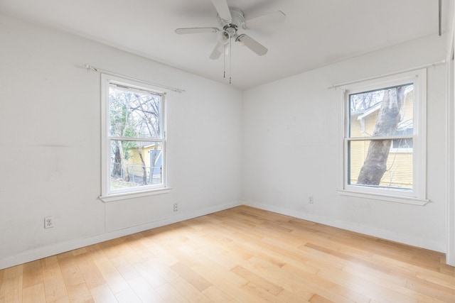 unfurnished room with ceiling fan and light wood-type flooring