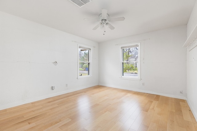 empty room with ceiling fan and light wood-type flooring